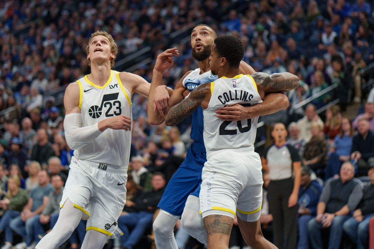 Nov 4, 2023; Minneapolis, Minnesota, USA; Minnesota Timberwolves center Rudy Gobert (27) is defended by Utah Jazz forward John Collins (20) and forward Lauri Markkanen (23) in the first quarter at Target Center. Mandatory Credit: Matt Blewett-USA TODAY Sports